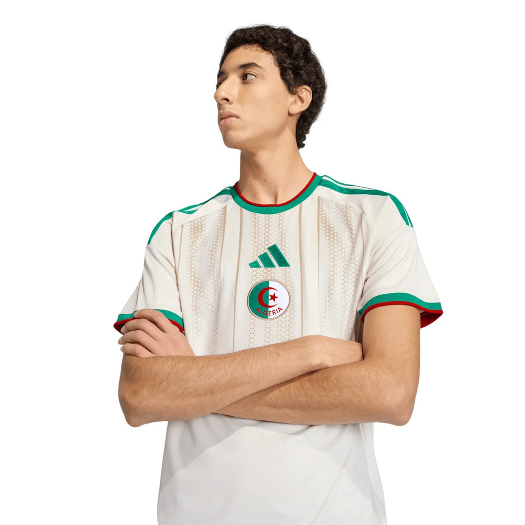 Maillot Fever Algeria national team football jersey in white with green and red trim, featuring subtle stripes and textured pattern.